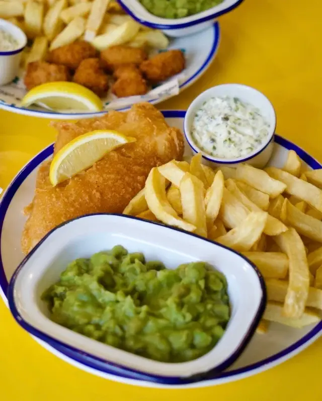 There’s something very British about a proper plate of fish and chips - and for #BritishFoodFortnight, we’re celebrating one of the key ingredients.

Our fish is frozen fresh at sea, locking in quality and freshness from the moment it’s caught. It’s then brought to our kitchen, dipped in our rich Norfolk IPA beer batter and fried until crisp and golden. 👌

We use MSC-certified sustainable fish, because great fish and chips should start with great ingredients and responsible sourcing.

From the sea to Norfolk, a British classic, done the Eric’s way. 👏 

#ericsfishandchips #notyouraveragechippy #fishandchips #sustainablefish
